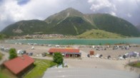 Archiv Foto Webcam Schöneben: Talstation der Bergbahn mit Blick auf Reschensee und Dorf Reschen 13:00