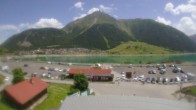 Archiv Foto Webcam Schöneben: Talstation der Bergbahn mit Blick auf Reschensee und Dorf Reschen 11:00